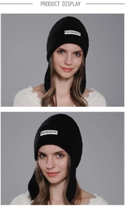 Detail of black knitted beanie with Short Sentence patch and ear protection