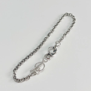 Minimalist 925 sterling silver knot heart chain bracelet with OT buckle on white background