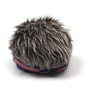 Detail of US flag patterned elastic band and thick grey-brown faux fur hair on novelty hat