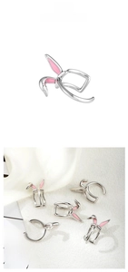 Detail showing pink enamel bunny ear clip-on earrings for non-pierced ears