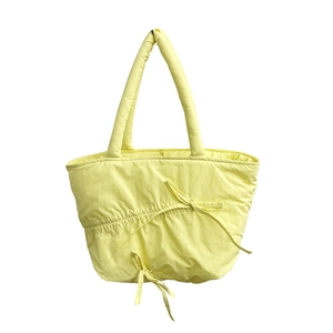 Summer pleated nylon tote bag in pastel yellow with cute drawstring bow design