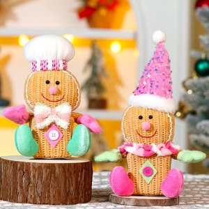 Detail of plush gingerbread man figurines with corduroy texture on a wooden base