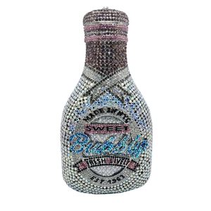 Macro shot of colorful rhinestone champagne bottle evening clutch with Sweet Bubble text