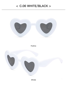 Detailed front and 45-degree side views of white heart-shaped sunglasses with black lenses