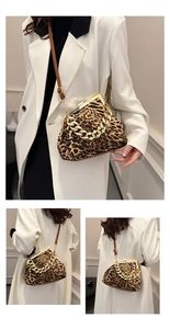 Close-up of leopard print shell bag featuring a thick gold chain and retro clasp closure