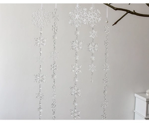 Macro view of transparent acrylic snowflake hanging ornaments for winter tree decor