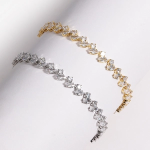 Detailed close-up of sparkling gold and silver marquise-cut cubic zirconia tennis bracelets
