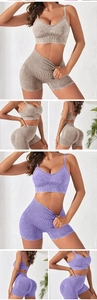 Detail of seamless ribbed high waist shorts and strappy yoga bra in washed fabric