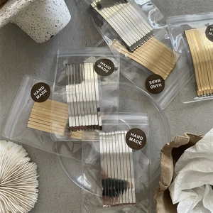 Minimalist gold and silver alloy hair clips set in transparent handmade packaging