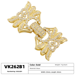 Macro shot of gold-plated brass multi-row pearl connector clasp with zircon heart pattern