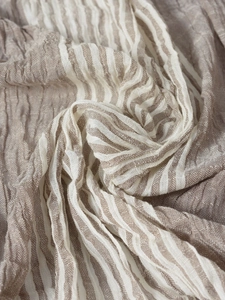 Macro shot of striped cotton linen fabric texture in brown and beige colors