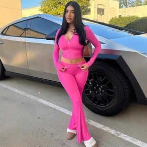 Hot pink two-piece set with zip-up long sleeve hooded top and flared pants for women