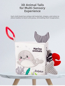 Close-up of soft marine animal cloth book with 3D multi-texture dolphin tails for infants