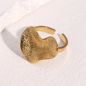 Irregular textured 18k gold plated stainless steel open ring with a hammered surface finish