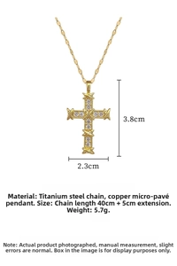 Detailed view of gold cross pendant with X-shaped binding and crystal pavé on 45cm chain