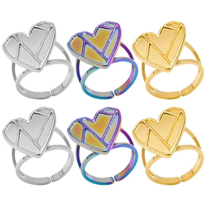 Close-up of geometric heart rings in silver, gold and rainbow finish with adjustable bands