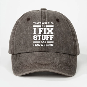 Detail of I FIX STUFF text and wrench graphic on washed cotton baseball cap