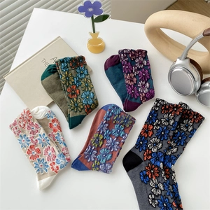 Five pairs of vintage floral patterned cotton crew socks for women in assorted retro colors