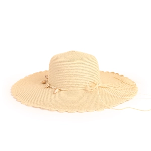 Detail of a wide-brimmed straw hat with shell decorations and wavy scalloped edges