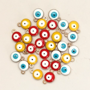 Macro shot of 8mm double-sided enamel evil eye pendants for DIY necklace making