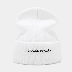 White knitted beanie with mama embroidery on a folded cuff for winter street style