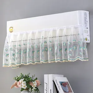 Detail of white lace air conditioner cover with elegant floral embroidery and wavy edge