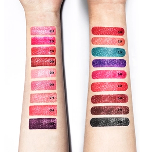 Swatches of 18 shimmering liquid lipstick shades on arms with numerical labels