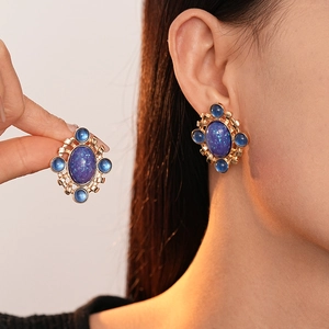 French vintage oval blue resin drop earrings with gold hollow metal filigree design