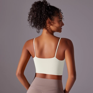 Detail of high-stretch white sports bra with slim double straps and back design