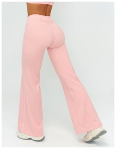 Rear view of pink high-waisted flared yoga pants with heart-shaped stitching detail