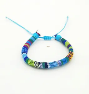 Detail of bohemian hand-woven colorful surfgrip bracelet with adjustable cord