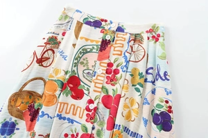 Detail of high waisted printed skirt with colorful patterns and white front buttons