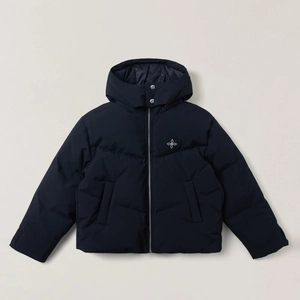 Detail of dark blue hooded puffer jacket featuring white cross embroidery and metal fasteners