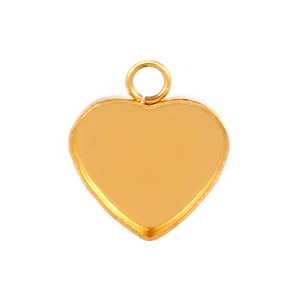 Macro shot of gold heart-shaped stainless steel pendant tray with attachment loop