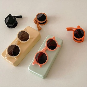 Foldable round kids sunglasses in macaron colors with portable matte storage cases
