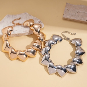Exaggerated metal heart choker necklaces in gold and silver finishes for women