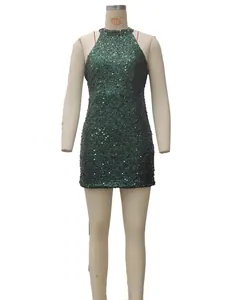 Detail of dark green halter dress with shimmering sequins and crystal fringe trim