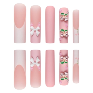 Long coffin french nails with pink cherry rhinestones and white ribbon bow accents