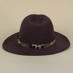 Detail of deep brown wide brim fedora with a leopard print decorative belt strap
