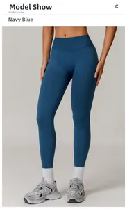 Detail view of high-waist seamless navy blue yoga leggings with textured stretch fabric