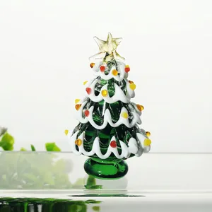 Handcrafted green glass Christmas tree ornament with white snow waves and colorful beads