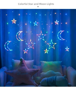 Detail view of colorful LED star and moon curtain lights hanging on a blue curtain