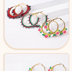 Detail view of colorful Miyuki beaded hoop earrings with bohemian flower patterns