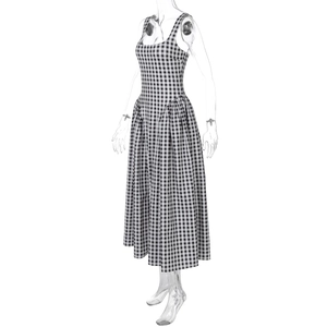 Detailed close-up of the black and white plaid dress with a square neckline and wide straps