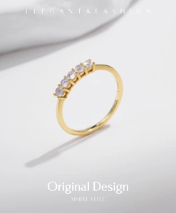 Detailed macro shot of gold plated s925 silver ring featuring five moonstones