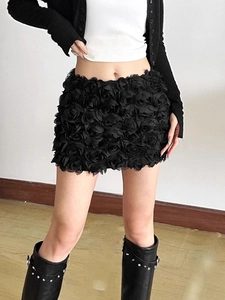 Chic black mini skirt featuring 3D rose petal fabric and low-waist fashion design