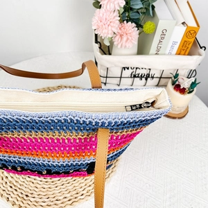 Detail view of colorful woven beach tote with zipper closure and durable inner lining