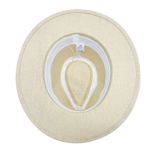 Classic wide brim straw Panama hat interior showing 100% paper material and size label