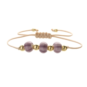 Close-up of handmade woven bracelet with purple beads and adjustable khaki cord