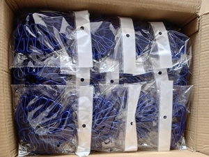 Blue retractable travel clothesline with multi-clips packed in bulk inside a carton box